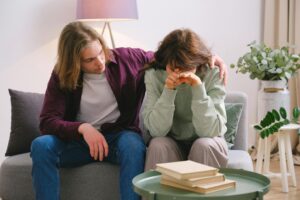 A man consoling their partner.