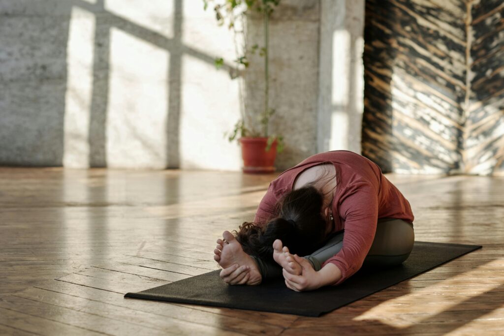 A woman doing yoga in a yoga studio.