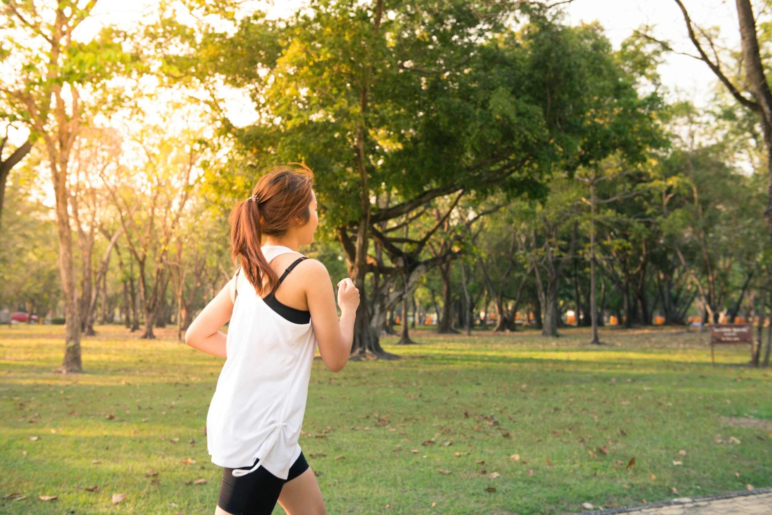 A woman running in a park.