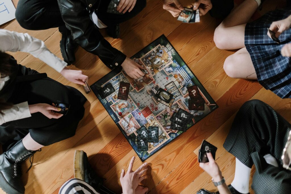 A group of people playing a boardgame.