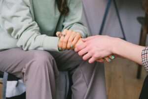 Two people holding hands.