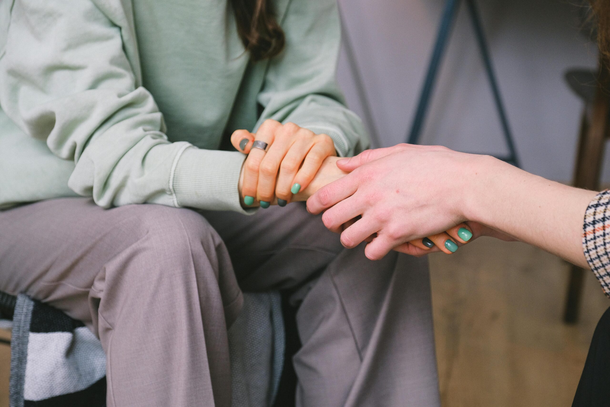 Two people holding hands.