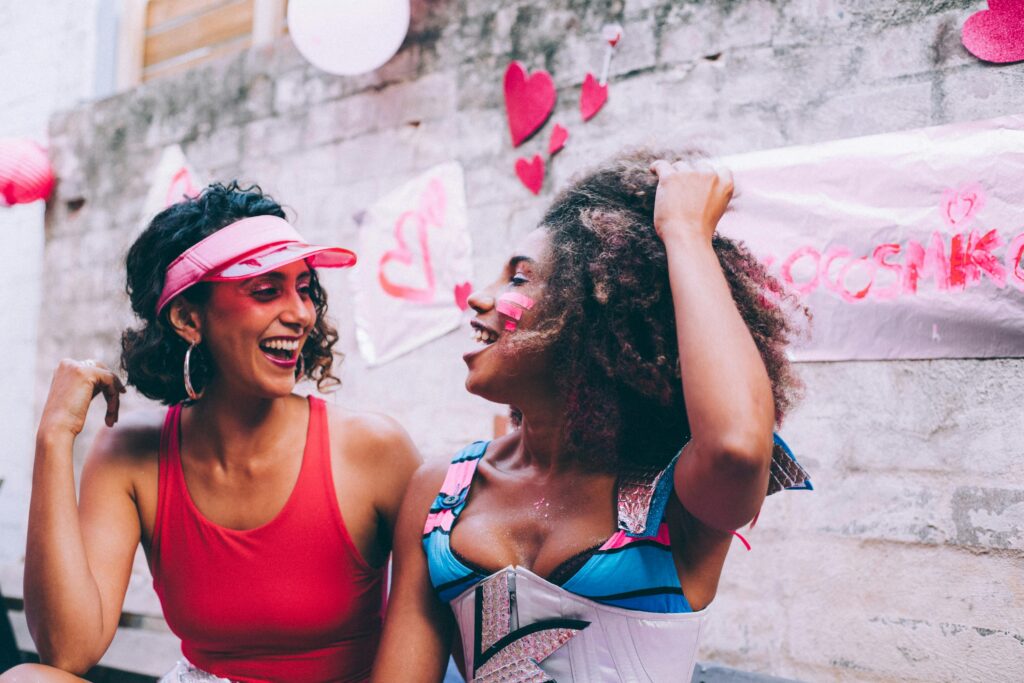 Two women sharing smiles with one another.
