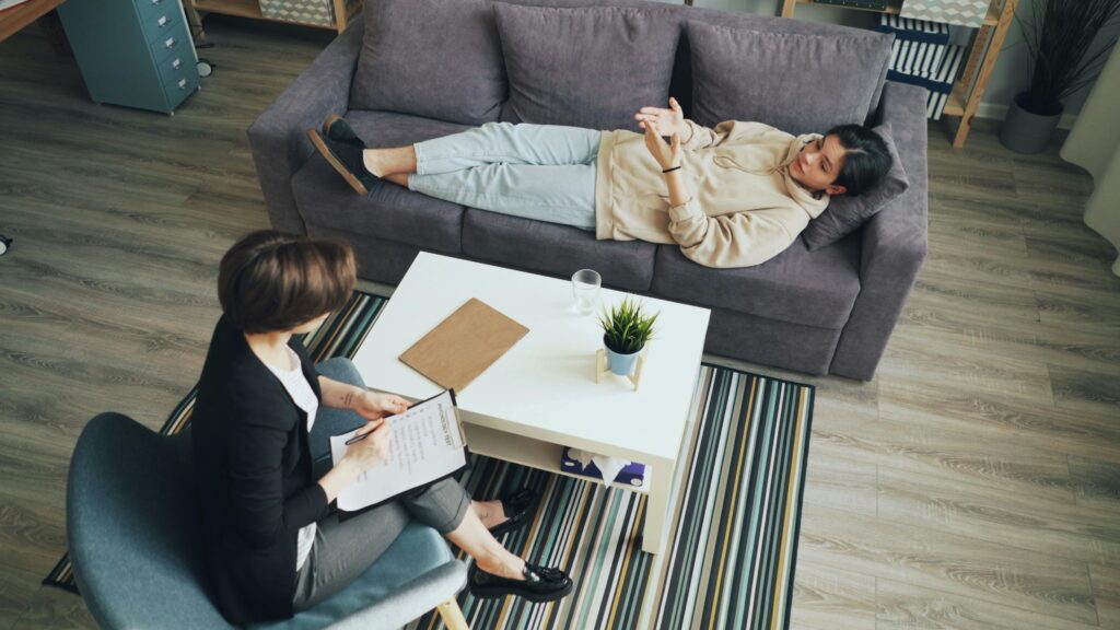 A woman in therapy to silence her inner critic and negative self-talk.