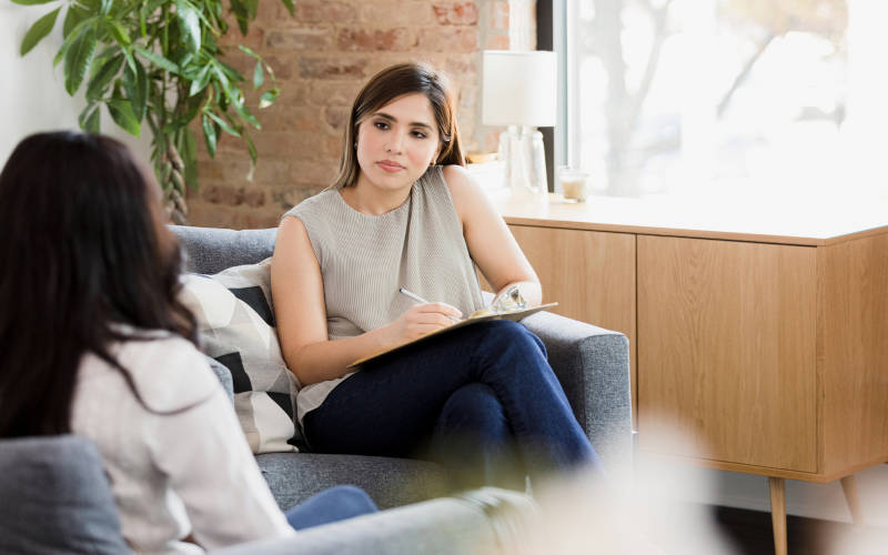 A woman therapist learning why women need women-only rehab programs.