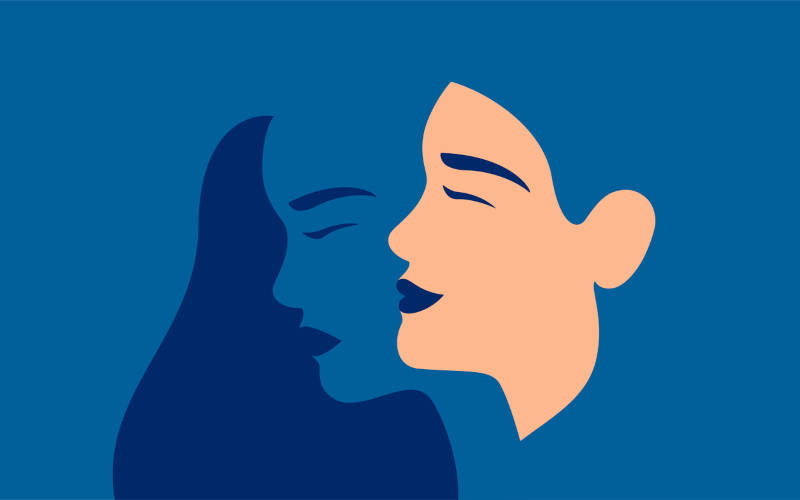 A cartoon image of a smiling, and sad face a woman, depicting bipolar disorder in women.