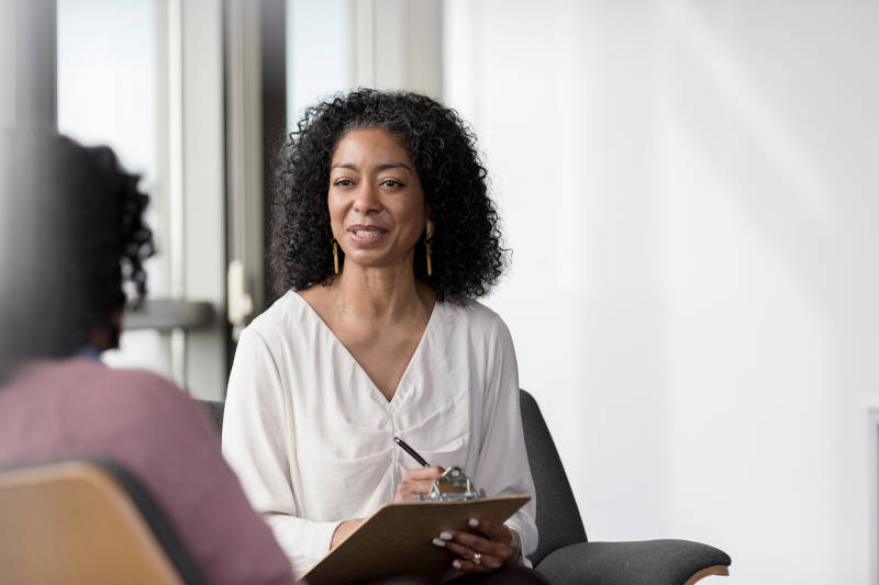 A therapist talking with her patient.